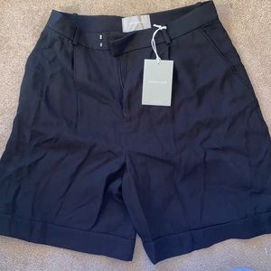 Black pleated shorts